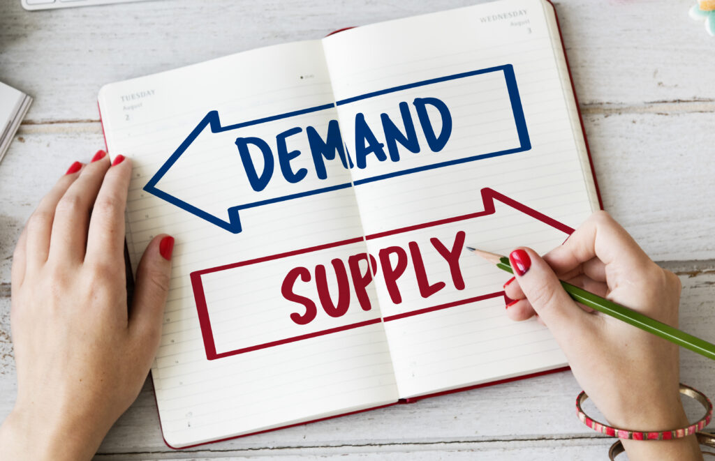 How do supply and demand create balance in the marketplace?